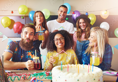 Laughing group of young friends celebrating
