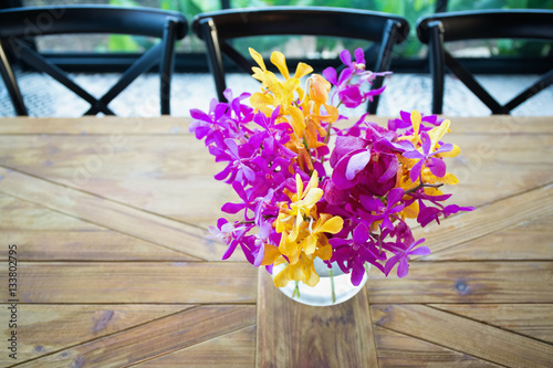 Colorful orchid in a glass flower vase
