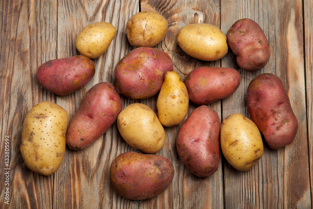 Potatoes on a rustic background Potatoes on a rustic background