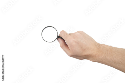 hand holding magnifier glass