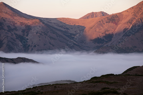 Fog in the bottom of the mountain valley. Peninsula Kony. Magadan Region. Russia.