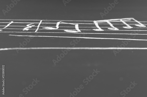 Musical notes on a blackboard © Сергей Лабутин