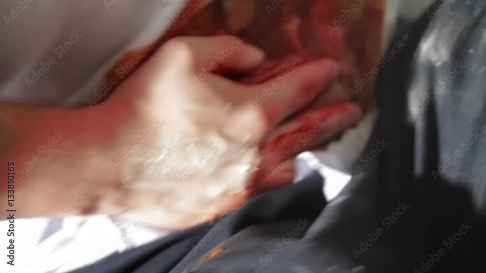 Man with a bleeding wound in the belly close-up Man with a bleeding wound in the belly close-up