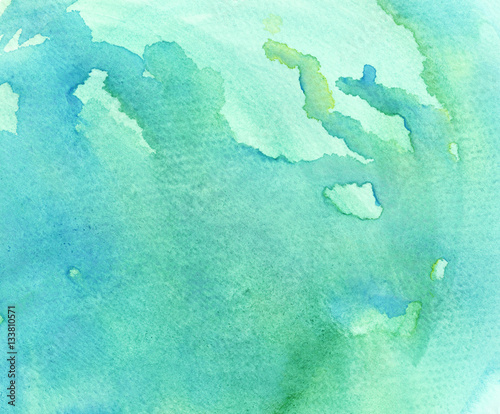 Abstract watercolor hand painted background in green shades 