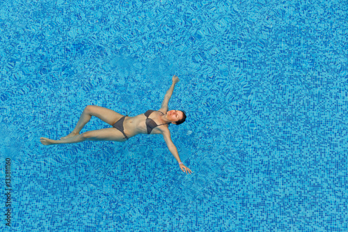 Young woman relaxing in the pool