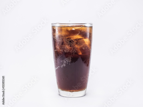 soft drink is cool with ice cubes in full glass on whtie backgro