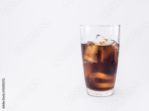 two of thirds soft drink is cool and ice cubes  in glass