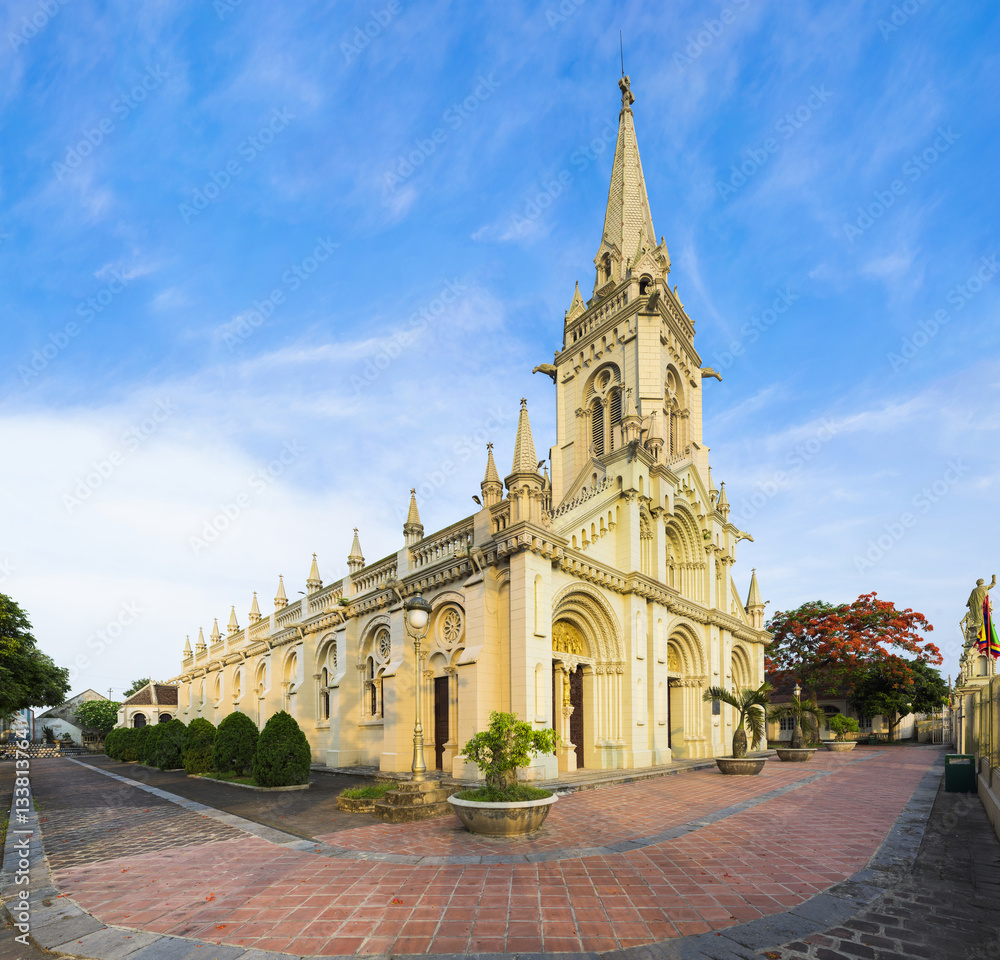 Panorama view of a commune church in Kim Son district, Ninh Binh province, Vietnam. The building is a travel destination for tourist visiting Ninh Binh