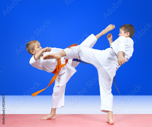 Circular kicks athletes are beating in karategi
