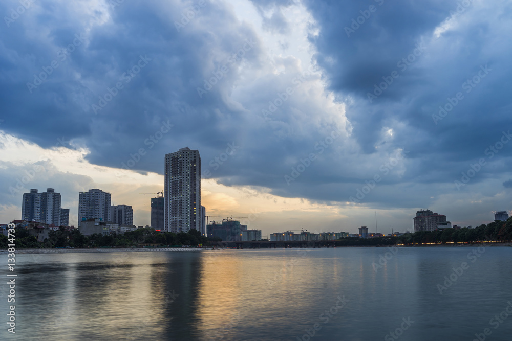 Linh Dam lake at sunset with cloudy sky. Hanoi cityscape