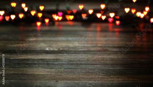 Heart bokeh, Valentine's day concept on wooden background