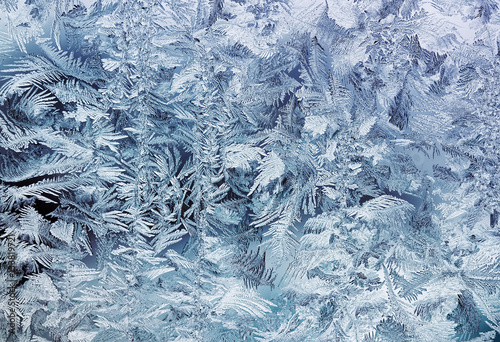 crystal white frost pattern on a cold morning glass