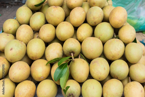 Sapodilla, tropical fruit displayed at Vinh Long fruit market, Mekong delta. The majority of Vietnam's fruits come from the many orchards of the Mekong Delta