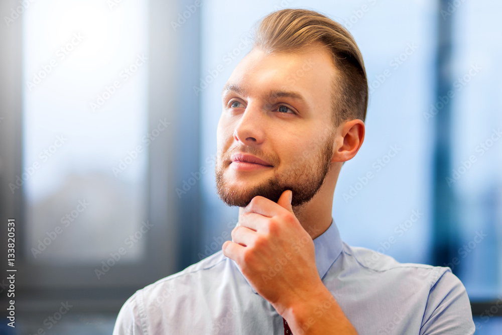 Portrait of a friendly businessman in his office Portrait of a friendly businessman in his office