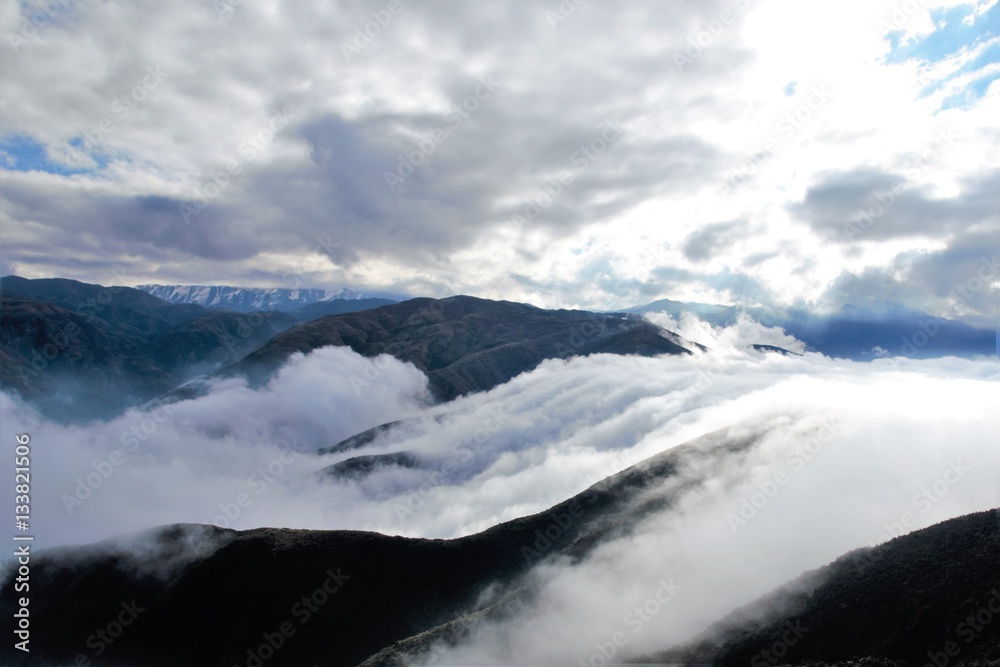 View over the clouds on top of the hill Cerro Arco close to Mendoza in Argentina, South America