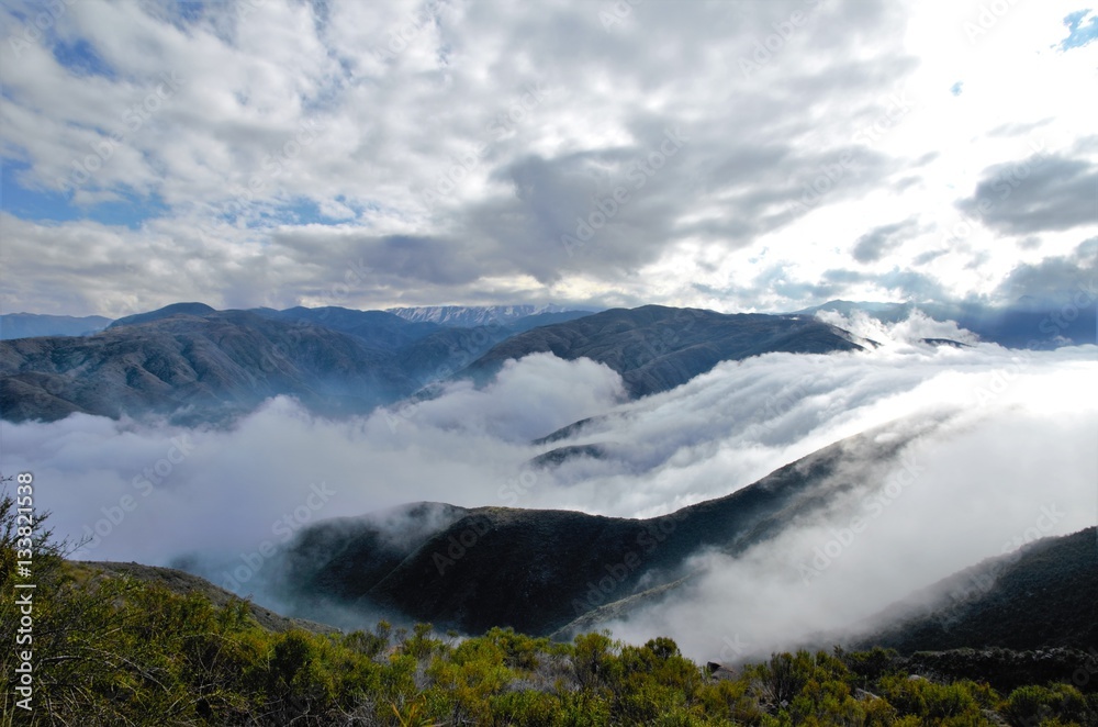 View over the clouds on top of the hill Cerro Arco close to Mendoza in Argentina, South America