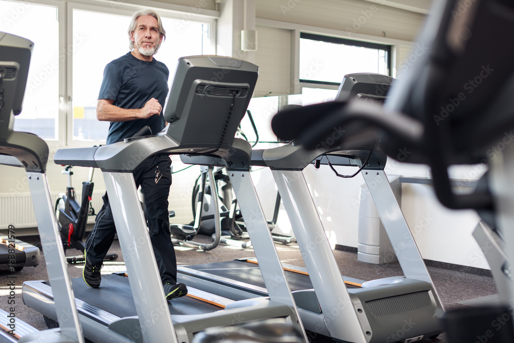 Fototapeta premium Senior Caucasian Man Working Out At The Gym