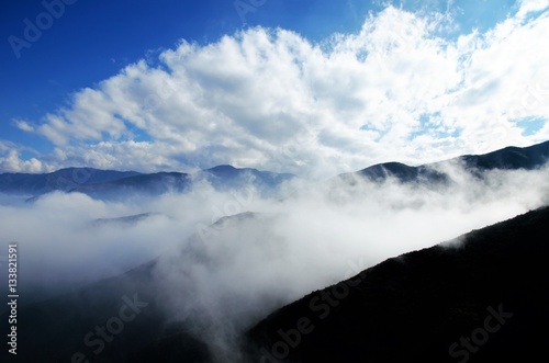 View over the clouds on top of the hill Cerro Arco close to Mendoza in Argentina, South America