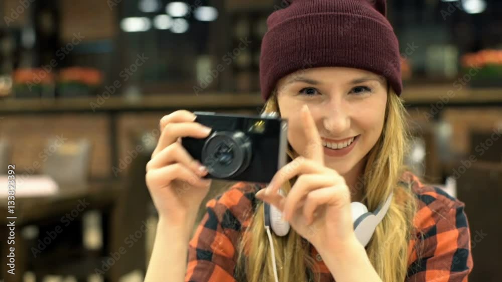 Happy, hipster girl sitting in the cafe and holding old camera, steadycam shot
Happy, hipster girl sitting in the cafe and holding old camera, steadycam shot