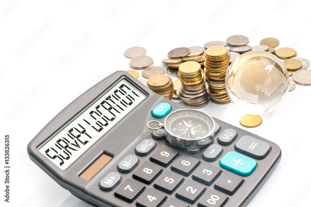 Compass, glass globe, coins and text on calculator with travelling concept. Compass, glass globe, coins and text on calculator with travelling concept.