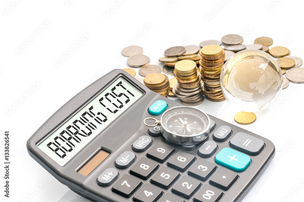 Compass, glass globe, coins and text on calculator with travelling concept. Compass, glass globe, coins and text on calculator with travelling concept.
