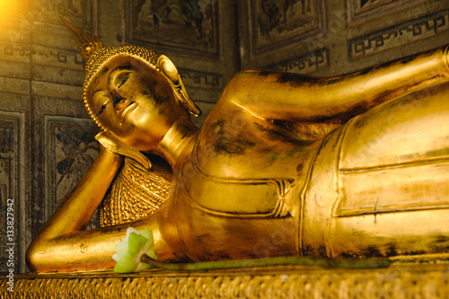 Public place Reclining Buddha gold statue in church Wat Suthattepwararam temple Bangkok, thailand. photo