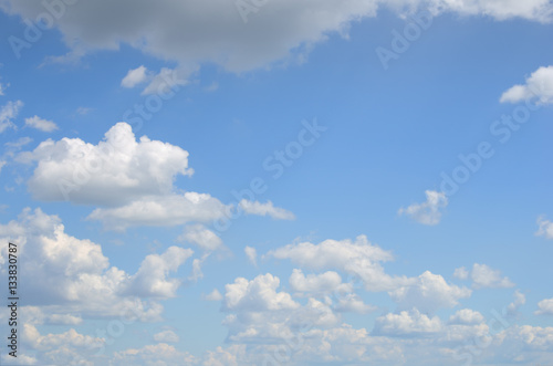 Fototapeta Naklejka Na Ścianę i Meble -  Blue sky with many of white and gray clouds above the water on summer day as a natural background for your text or picture; cloudscape running to horizon