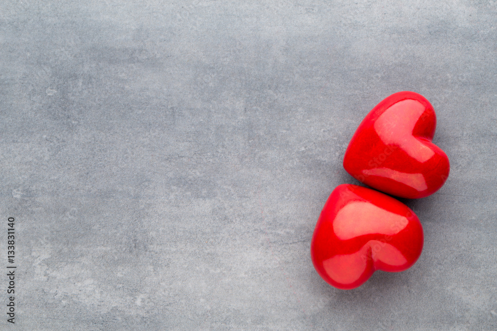 Red heart on the gray background.