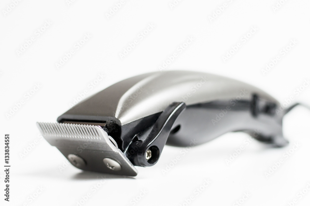 steel hair clipper on a light background steel hair clipper on a light background