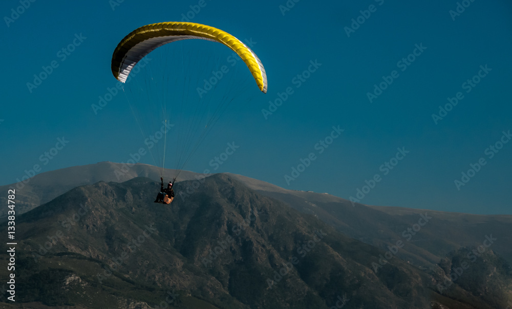 paragliding on a background of mountains and sky paragliding on a background of mountains and sky