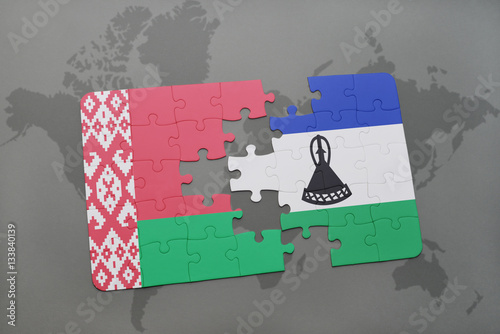 puzzle with the national flag of belarus and lesotho on a world map