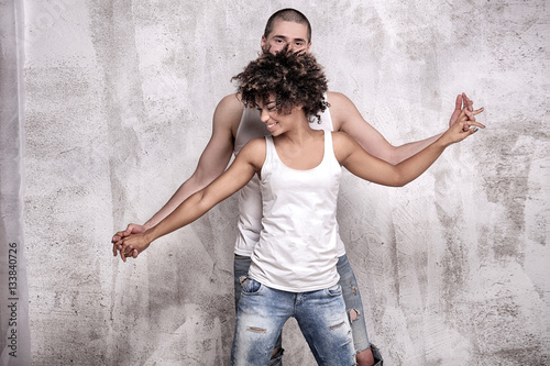 Young couple posing together.