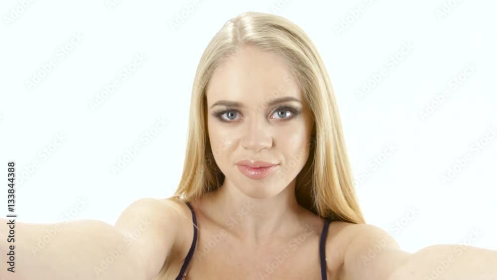 Blonde girl doing different poses and emotions on camera. Studio Blonde girl doing different poses and emotions on camera. Studio