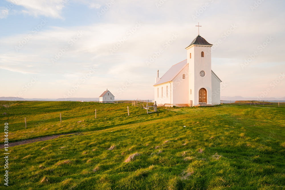 Church on the island Flatey Iceland at midnight in june