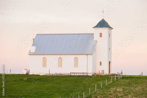 Church on the island Flatey Iceland at midnight in june