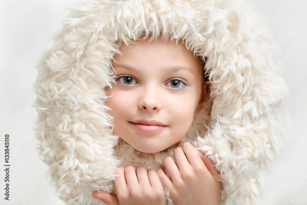 Beautiful little girl in winter clothes