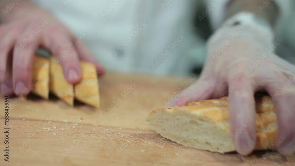 Chef serving crusty baguette Chef serving crusty baguette