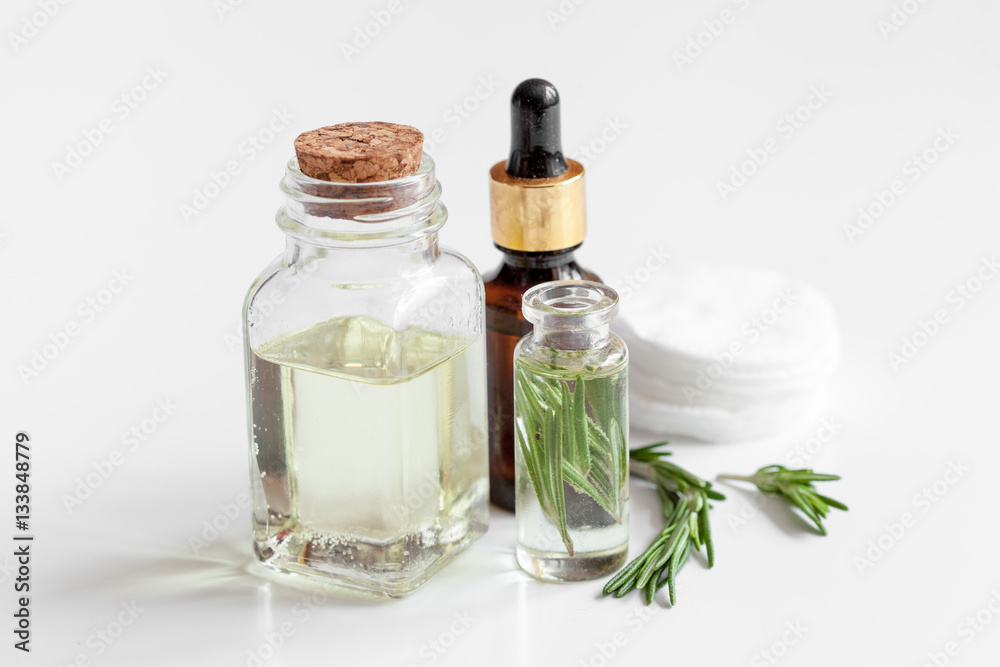 organic cosmetics with extracts of herbs rosemary on white background organic cosmetics with extracts of herbs rosemary on white background