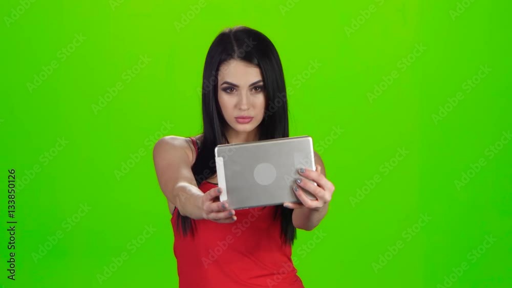 Selfie photo using the front camera of tablet. Green screen Selfie photo using the front camera of tablet. Green screen