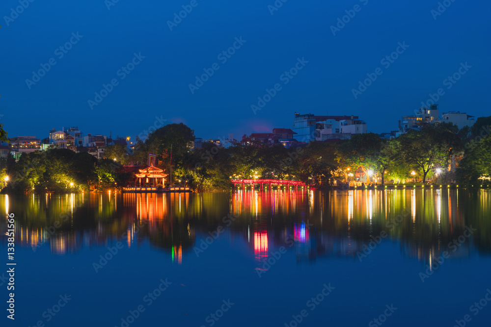 Hoan Kiem lake view at twilight with Ngoc Son old temple and The Huc bridge. Hoan Kiem lake (Sword lake or Ho Guom) is center of Hanoi