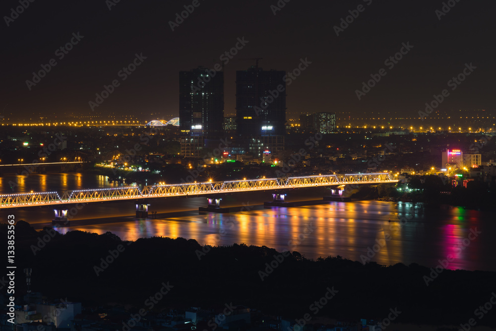 Aerial view of Long Bien bridge at night. Hanoi skyline cityscape