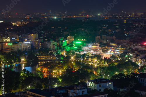 Aerial view of a corner of Hoan Kiem lake ( Sword lake, Ho Guom in Vietnamese ) at sunset time. Hanoi skyline view. Hoan Kiem lake is center of Hanoi
