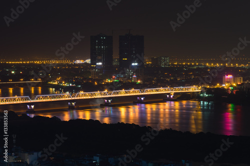 Aerial view of Long Bien bridge at night. Hanoi skyline cityscape