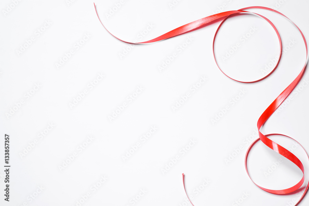 Festive red ribbon isolated on white background Festive red ribbon isolated on white background