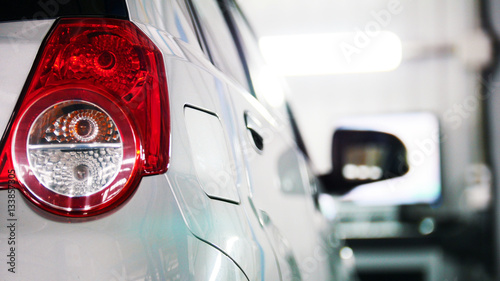 Foto Auto service - red backlights of white car, transportation concept