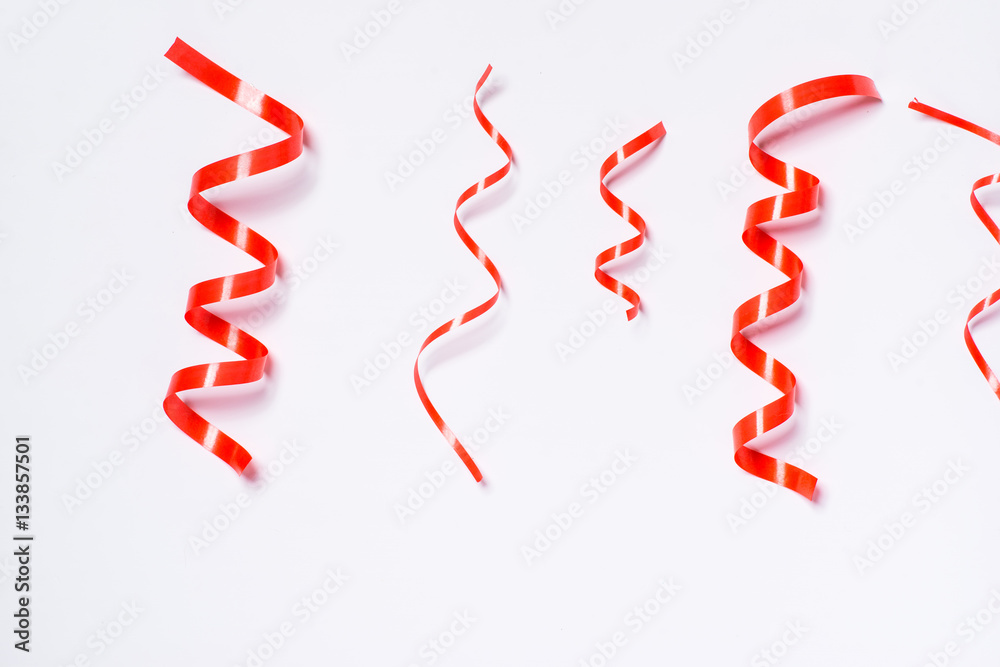 Festive red ribbon isolated on white background Festive red ribbon isolated on white background