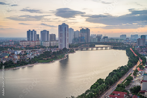 Aerial view of Hanoi cityscape at twilight. Linh Dam lake