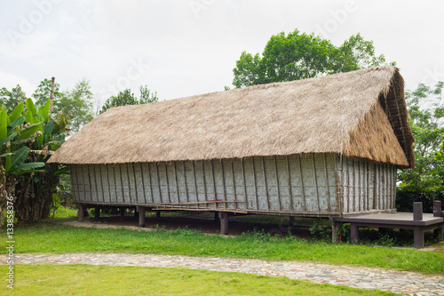 Typical house of J'rai people in central high land of Vietnam photo