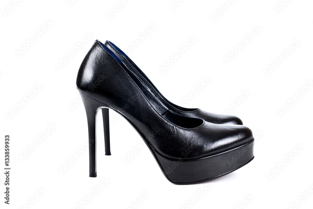 Black women's high-heeled shoes on a white background Black women's high-heeled shoes on a white background