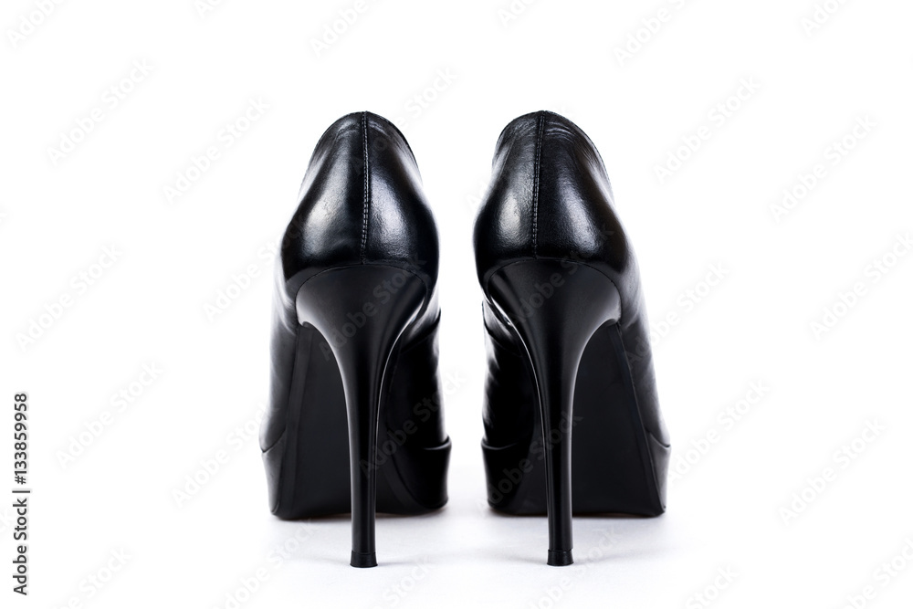 Black women's high-heeled shoes on a white background Black women's high-heeled shoes on a white background
